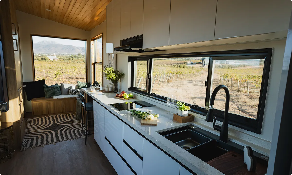 Interior of Clever Studio tiny home showing kitchen and living area
